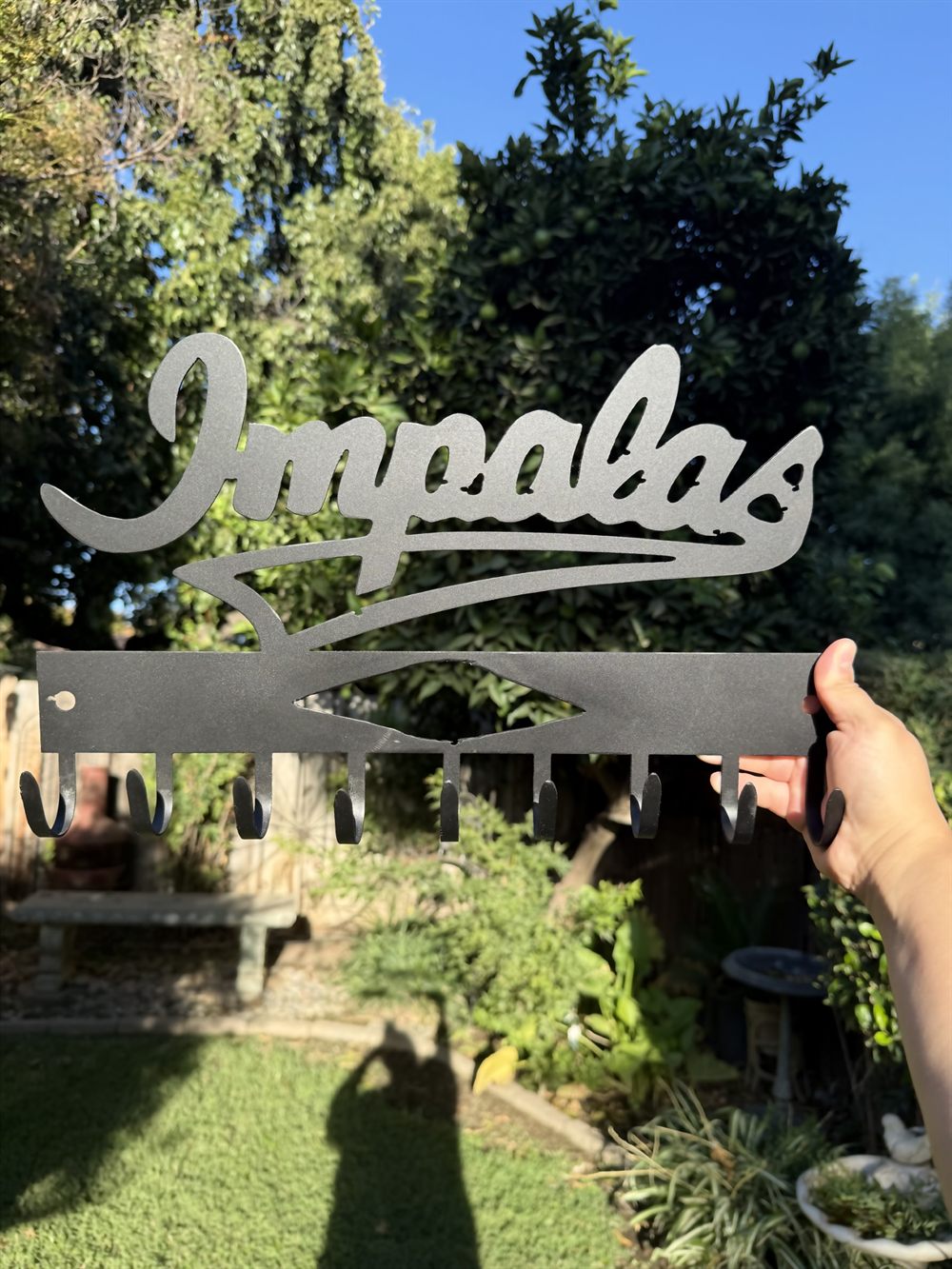 The word Impalas cut in flowing steel script.